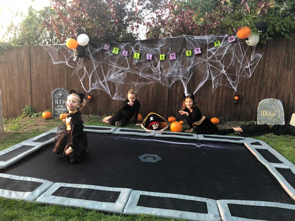 Children playing on Capital Play trampoline